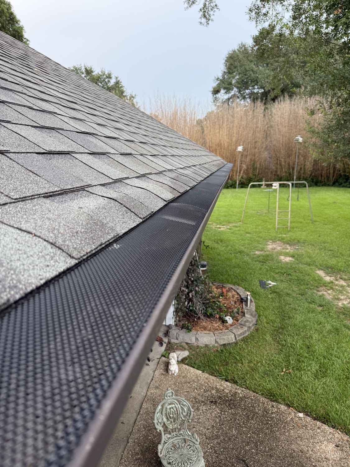 The same gutter after cleaning with micro-mesh gutter guard installed